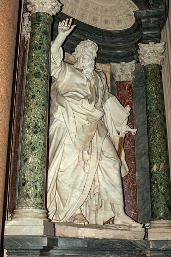 Rome, Italy - October 10, 2007: A marble sculpture of St. Paul in the Nave of the Basilica of San Giovanni in Laterano sculpted by Pierre-Étienne Monnot between 1708 and 1718