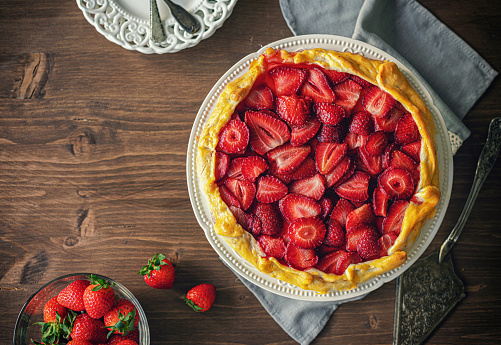 Preparing strawberry galette or open strawberry pie at home