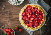 Preparing strawberry galette or open strawberry pie