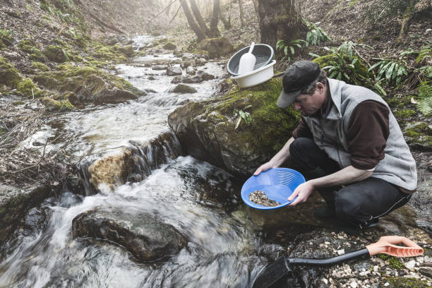 istock Outdoor adventures on river. Gold panning, search for gold 2094828193