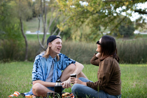 istock Young couple enjoying in a public park in Buenos Aires while drinking yerba mate 2094867524