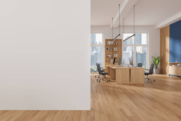 istock Coworking interior with desk and shelf, workplace near window. Mock up wall 2094882550