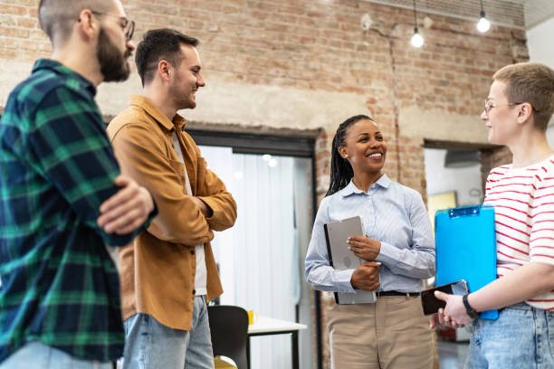 istock Young diverse colleagues having a casual business discussion 2094887260