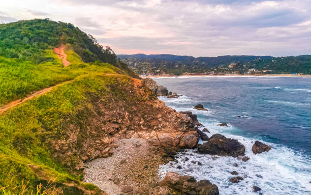 istock Punta Playa Cometa sunset panorama view mountains rocks path Mazunte Mexico. 2094887283