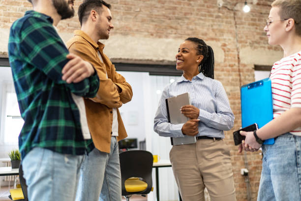 istock Young diverse colleagues having a casual business discussion 2094889453