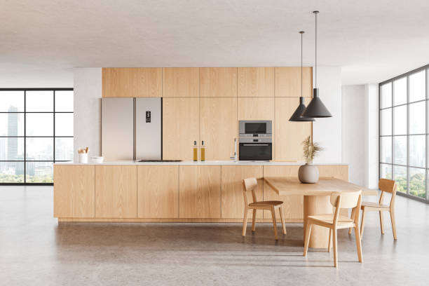 istock Modern home kitchen interior with cabinet and eating table, panoramic window 2094891947