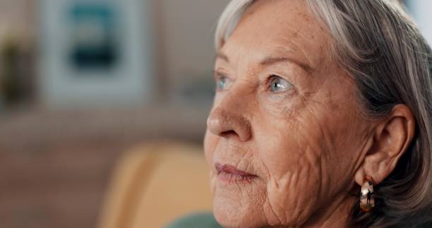istock Thinking, depression and regret by old woman, home and retirement while feeling lonely. Remember, mental health and nostalgia by senior female person in closeup, mourning and alone with memories 2094902583