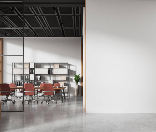 istock Stylish meeting interior with table and chairs, shelf and mockup wall 2094905189