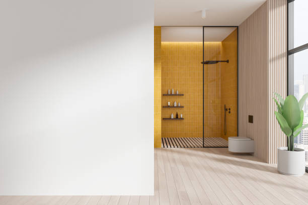 Modern home bathroom interior with glass shower and toilet, panoramic window