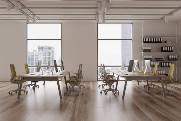 istock Stylish coworking interior with desk and shelf, workplace near panoramic window 2094909931