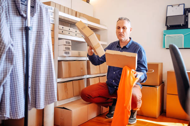istock Man packing goods and preparing it for delivery service 2094910465