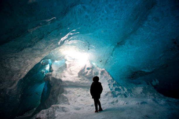 istock Woman in Ice Cave, Iceland 2094910483