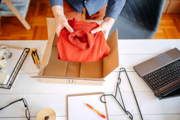istock Man packing goods and preparing it for delivery service 2094910492