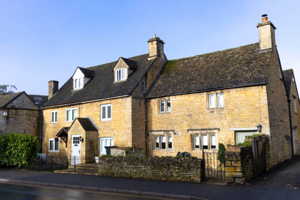 3rd March, 2024 - Bourton on the Water, Cotswolds: A beautiful building stands as a testament to the quintessential English charm of Bourton on the Water. Set in the heart of the Cotswolds, this structure exemplifies the traditional architectural style that defines this picturesque village, known for its scenic beauty and tranquil waterways. The image captures the essence of rural England, where history and nature blend harmoniously.