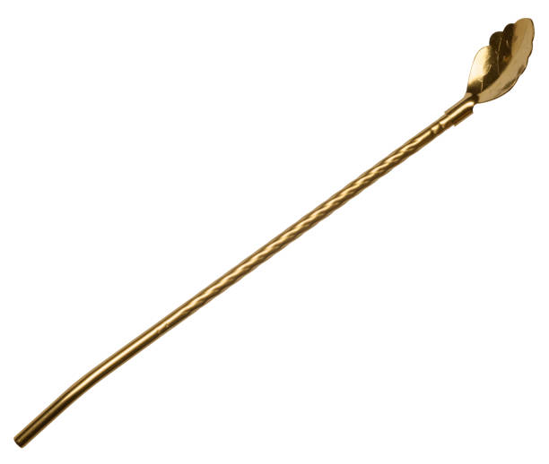 istock Golden cocktail spoon straw on isolated background 2095018559
