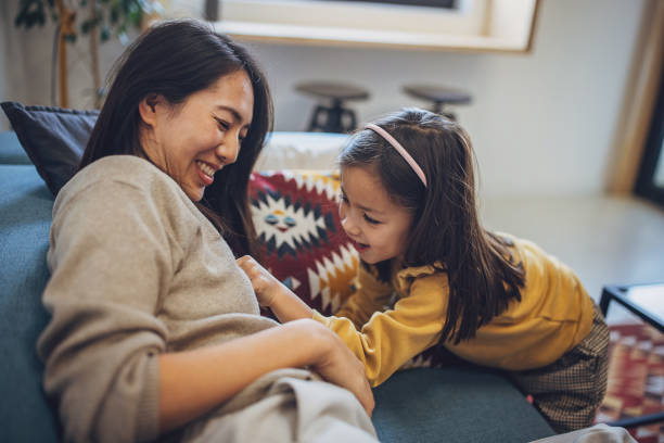 istock Mom and daughter playing 2095042645