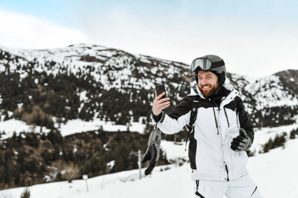 istock Smiling Male Having A Video Call Before Skiing On Mountain 2095086164