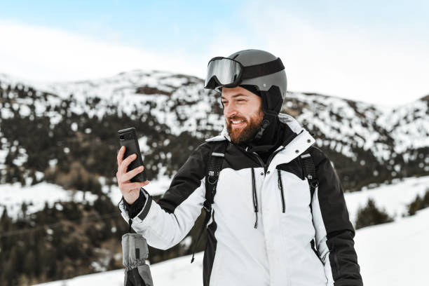 istock Smiling Male Taking Selfie During Skiing Weekend 2095086670