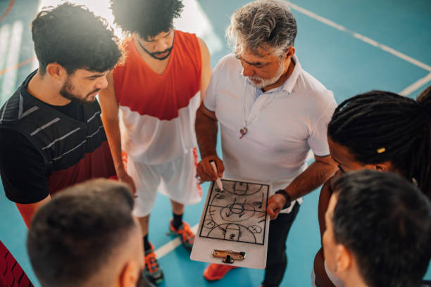 istock Top view of basketball coach explaining game plan with interracial team. 2095117526