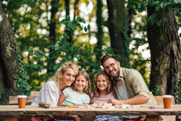 istock Happy family hugging and spending time in nature together. 2095117533
