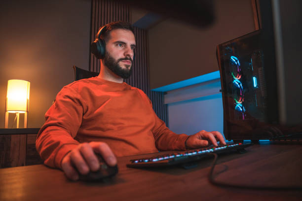 istock After-Hours Fun, Mid Adult Man Diving into the Virtual Realm 2095131945
