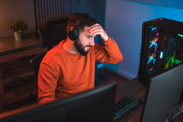istock Male Gamer Showing Frustation to In-Game Challenges 2095131952