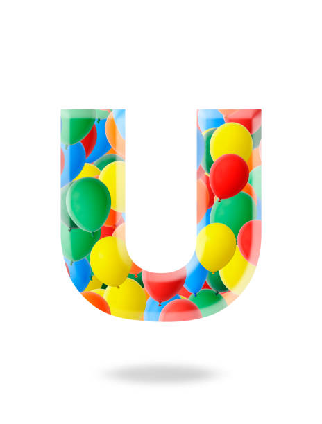 Close-up of three-dimensional multi colored balloon alphabet letter U on white background.