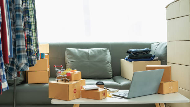 istock Online store owners check orders from websites on the internet to confirm orders with customers and pack products for shipping in parcel boxes. SME concept selling products online 2095336593
