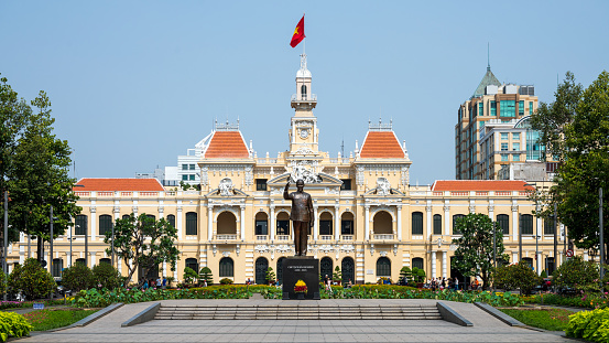 Slight side angle of HCM City central government building with street and sky