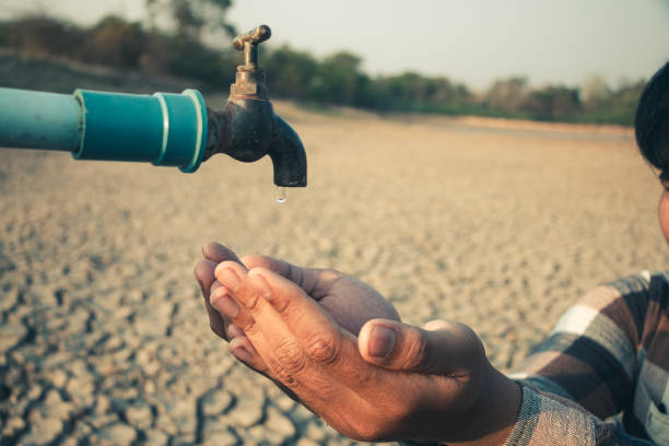 istock Hand for drinking water to live through drought, Concept drought and crisis environment. 2095357484