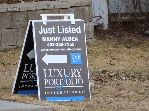 Calgary, Alberta, Canada. Mar 17, 2024. A Just Listed real estate sign outside of a house for sale.