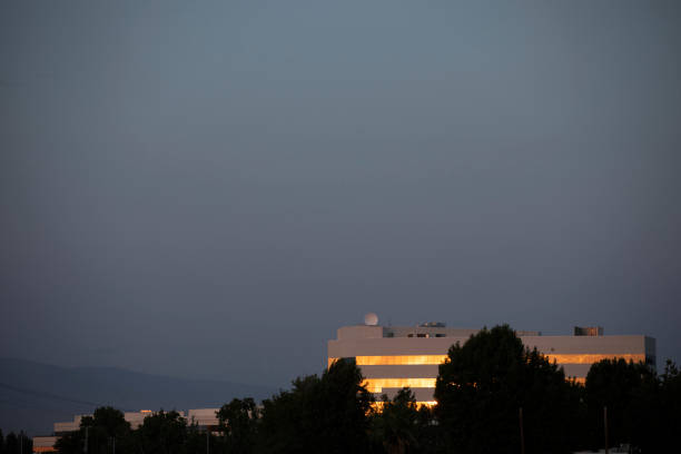 Bakersfield, California, USA - July 13, 2021: Sunset light shines on the western skyline and surrounding neighborhood of Bakersfield.