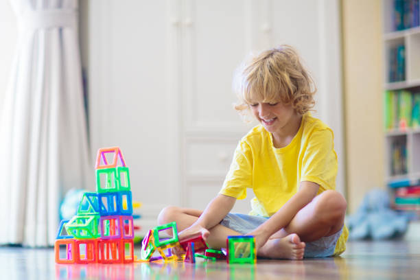 istock Child playing with magnetic building blocks. 2095543580