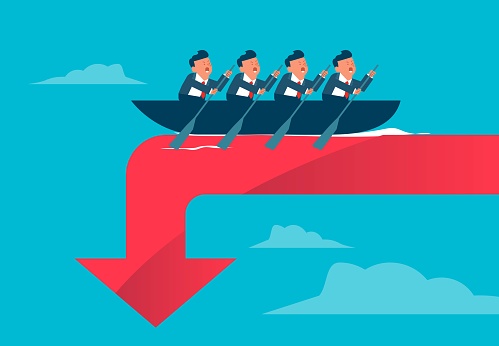 Conquering adversity by swimming upstream, working together to get out of trouble and distress, teamwork, team members rowing on the edge of a waterfall