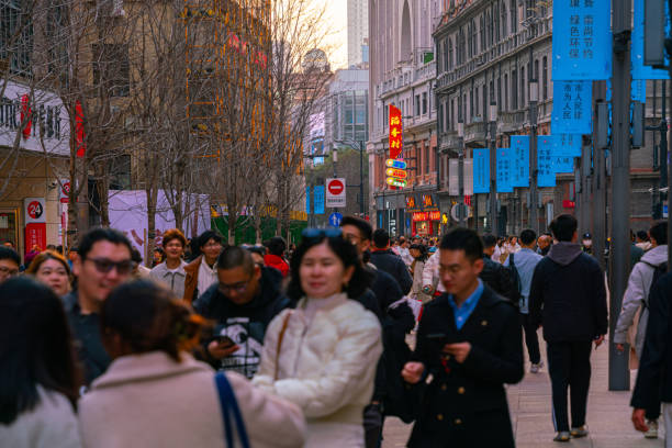 Portraits of people of Chinese origin during the New Year of the Dragon parade in Madrid