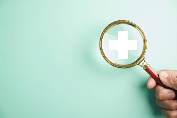 istock magnifying glass work on plus symbol and healthcare icon 2095580111