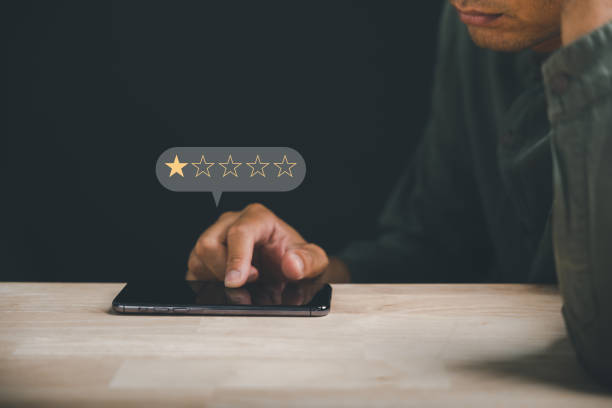 istock Unhappy client rates 1 star on social media using a smartphone 2095580638