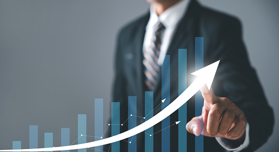 From business analysis to financial investment, tech concept to success, growing growth, a journey unfolds. Financial graph on virtual screen symbolizes the interplay of progress.