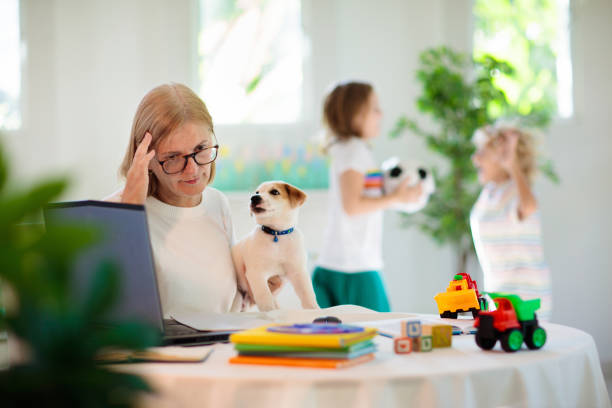istock Mother working from home with kids. 2095584383