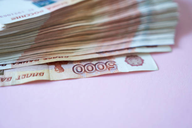 Banknotes Russian ruble on a pink background. 5000 banknotes.