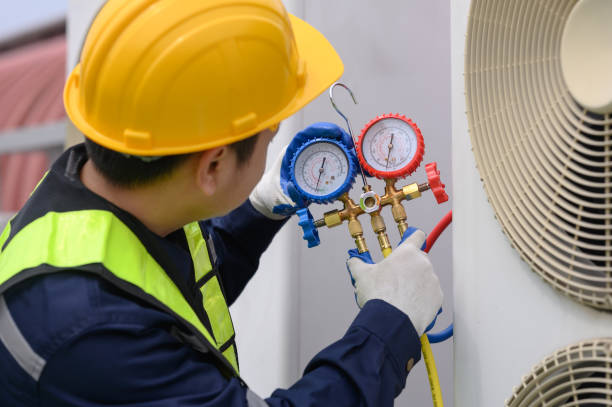 istock Selective focus of car air conditioning technician's hand refilling car air conditioner refrigerant 2095699275