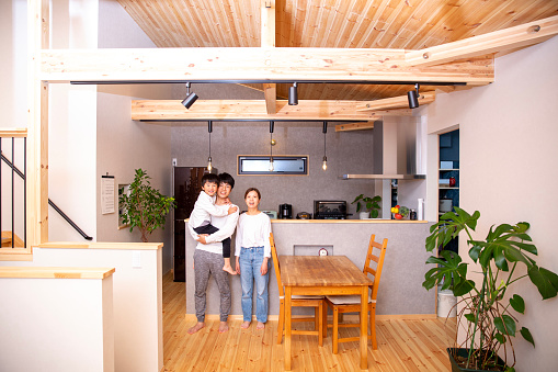 Japanese family, smiles, and the kitchen of their new home