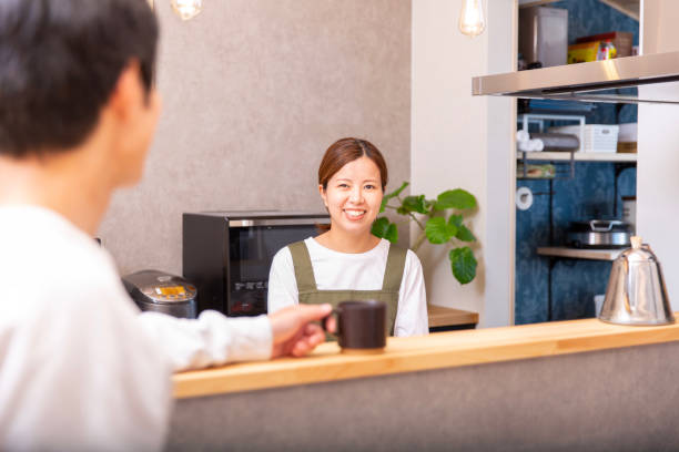 istock Young Japanese couple, everyday life, conversation over coffee 2095720084