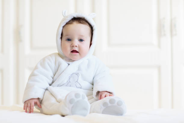 istock Little baby on white bed 2095730138