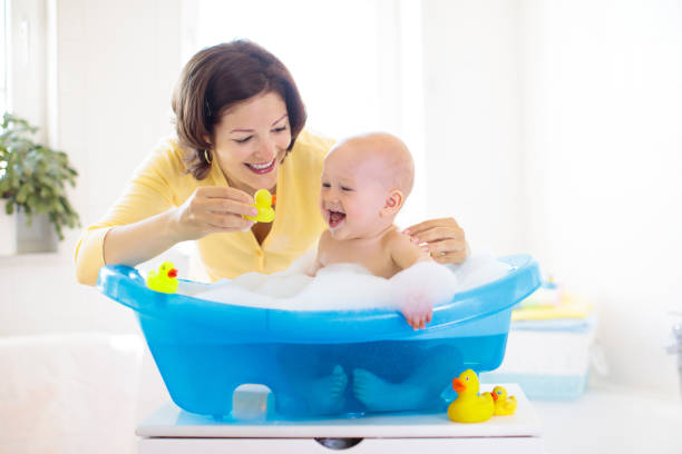 istock Mother and baby in bath 2095730646