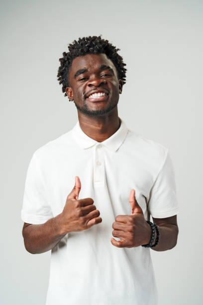 istock Man in White Shirt Giving Thumbs Up 2095731156