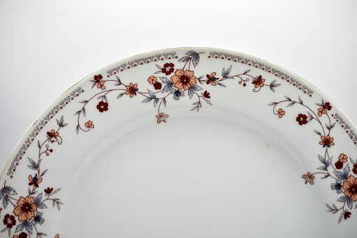 Cups and plates with delicate flower pattern