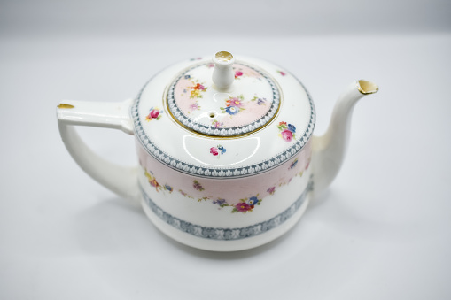 small porcelain teapot with cheerful flower pattern