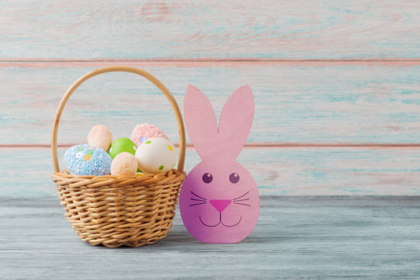 istock A basket full of Easter eggs and a rabbit figurine 2095754325