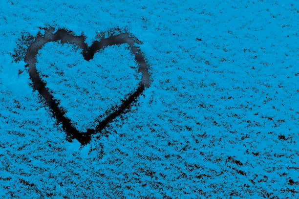 istock a heart on a blue textured background. concept 2095795333